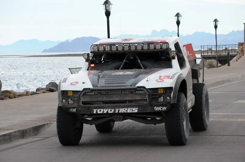 White trophy truck parked on the Loreto malecón during the 2023 Baja 1000