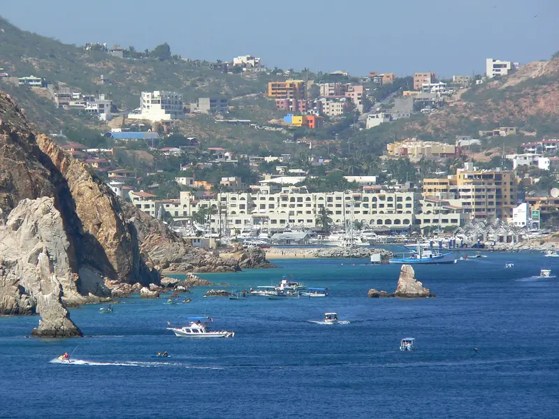 Hotels of Cabo San Lucas above the bay, with the rocks of Land's End on the left