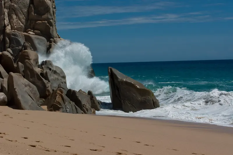 Waves breaking on granite rocks at a Pacific beach near Land's End, Cabo San Lucas