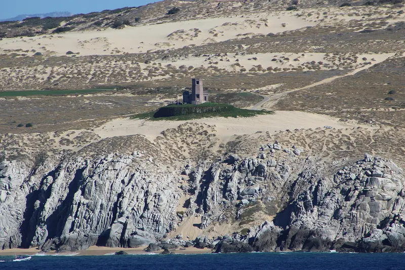 The old Cabo Falso lighthouse on the dunes above the Pacific cliffs