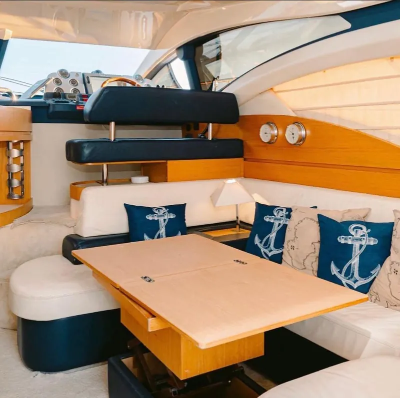 The air-conditioned salon of the Azimut 45, with its lower helm, wraparound settee and convertible dinette table