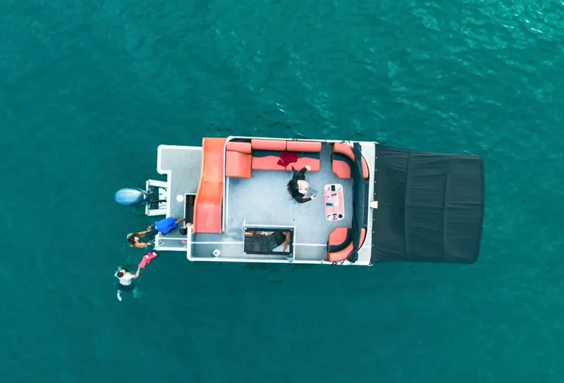 Pontoon 38 double-deck party pontoon with a water slide for private charter in Cabo San Lucas