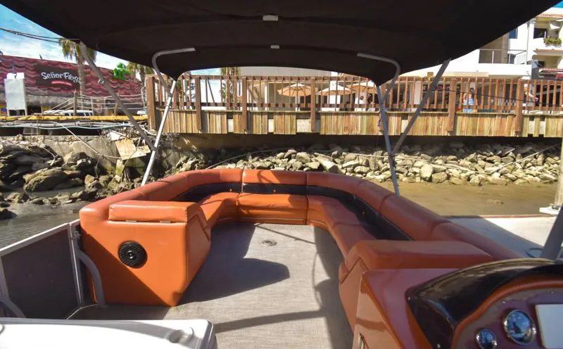 Bow lounge and helm of the Pontoon 38 party pontoon docked at Marina Cabo San Lucas